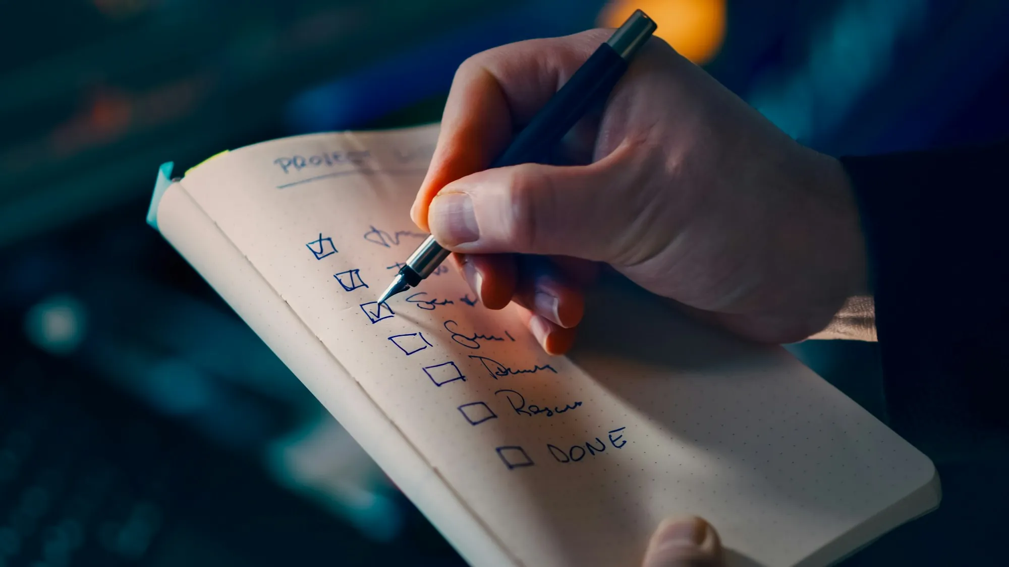 Hand checking boxes on a printed checklist